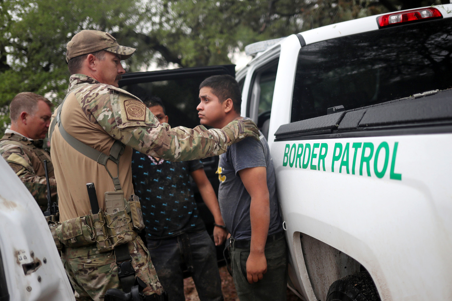 Members of the Border Patrol Search, Trauma, and Rescue Unit near Falfurrias, Texas, apprehend an immigrant from Guatemala June 19. Pope Francis told Reuters he stands with the U.S. bishops in their condemnation of the Trump administration’s immigration policy has led to children being held in government shelters while their parents are detained in federal prison.